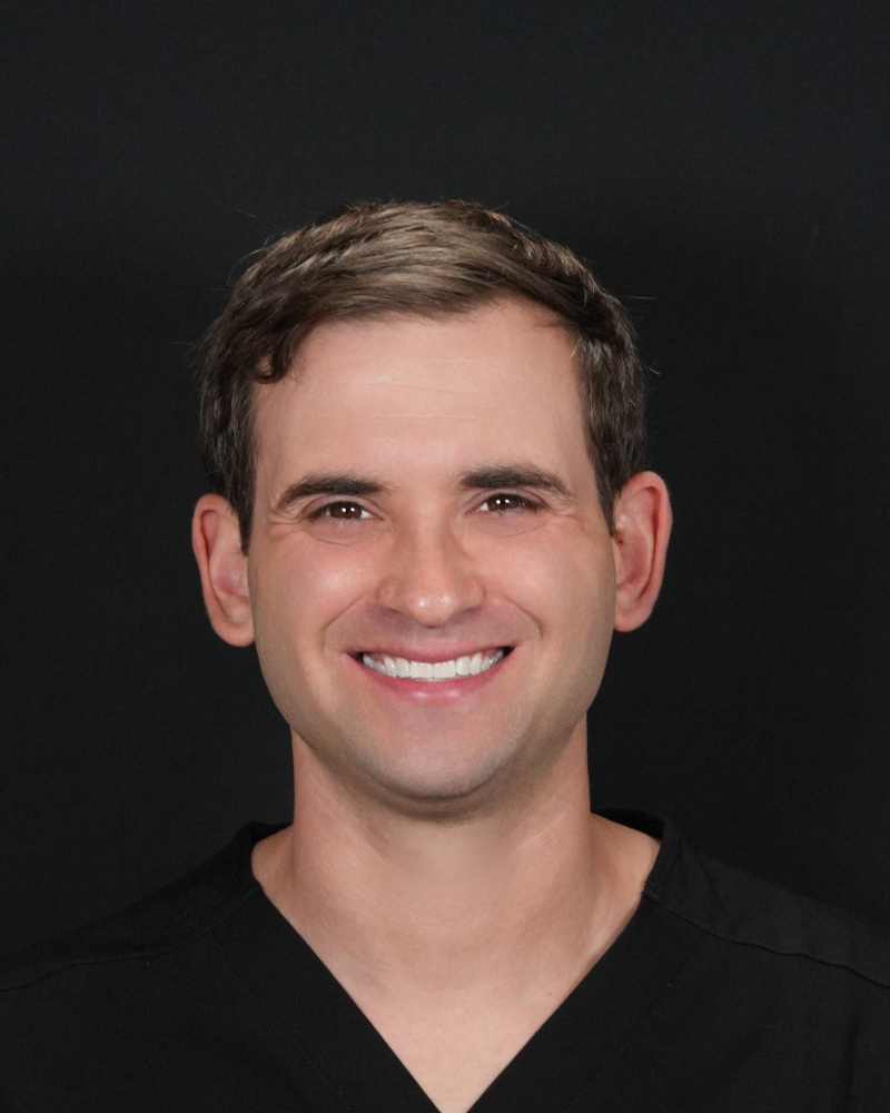 Handsome dentist with white teeth